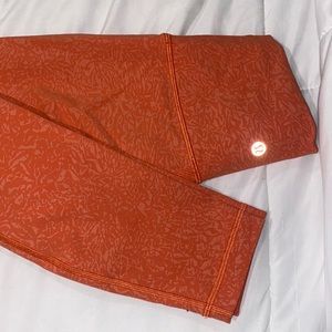 Lululemon orange leopard pattern leggings. Size 2